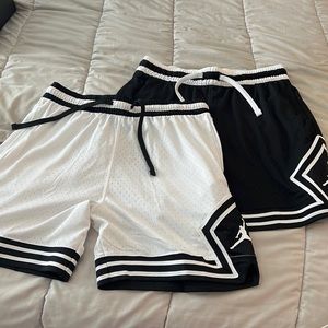 2 pairs of Jordan basketball shorts black and white size large